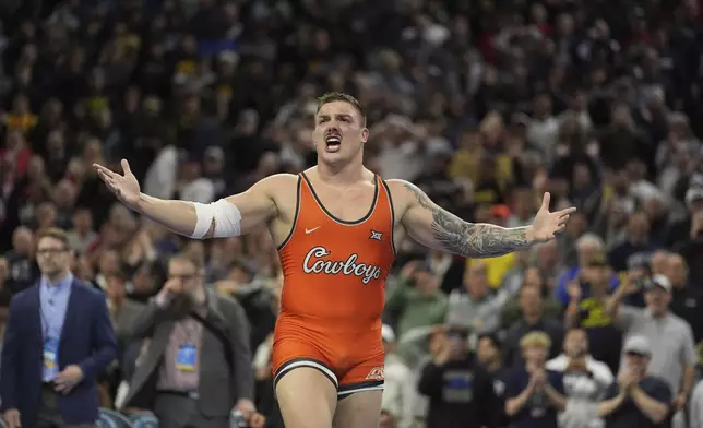 Oklahoma State's Wyatt Hendrickson reacts after defeating Minnesota's Gable Steveson during a 285-pound match in the finals at the NCAA wrestling championship, Saturday, March 22, 2025, in Philadelphia. (AP Photo/Matt Rourke)