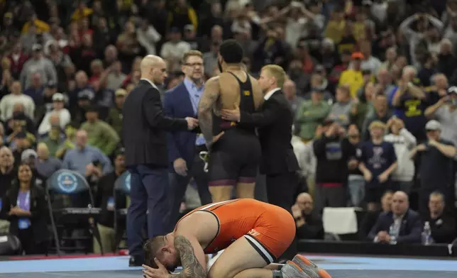 Oklahoma State's Wyatt Hendrickson reacts after defeating Minnesota's Gable Steveson during a 285-pound match in the finals at the NCAA wrestling championship, Saturday, March 22, 2025, in Philadelphia. (AP Photo/Matt Rourke)