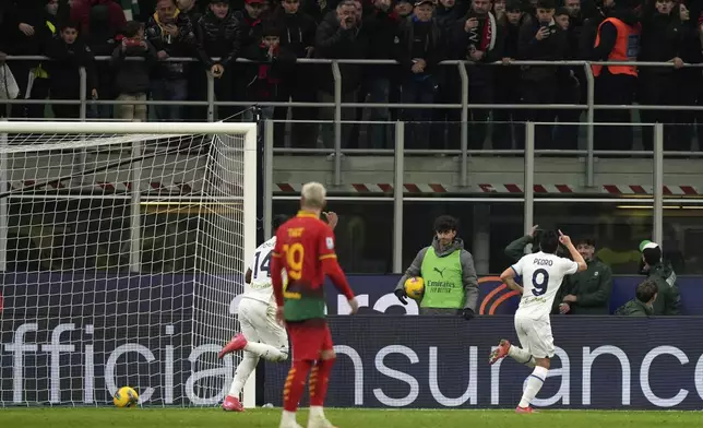 Lazio's Pedro, right, celebrates after scoring his sides second goal during the Serie A soccer match between AC Milan and Lazio at the San Siro stadium, in Milan, Italy, Sunday, March 2, 2025. (AP Photo/Antonio Calanni)