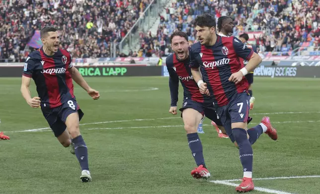 Bologna's Riccardo Orsolini, right, celebrates after scoring during the Italian Serie A soccer match between Bologna and Cagliari at the Renato Dall'Ara Stadium, in Bologna, Italy, Sunday, March 2, 2025. (Michele Nucci/LaPresse via AP)