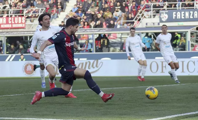 Bologna's Riccardo Orsolini scores during the Italian Serie A soccer match between Bologna and Cagliari at the Renato Dall'Ara Stadium, in Bologna, Italy, Sunday, March 2, 2025. (Michele Nucci/LaPresse via AP)