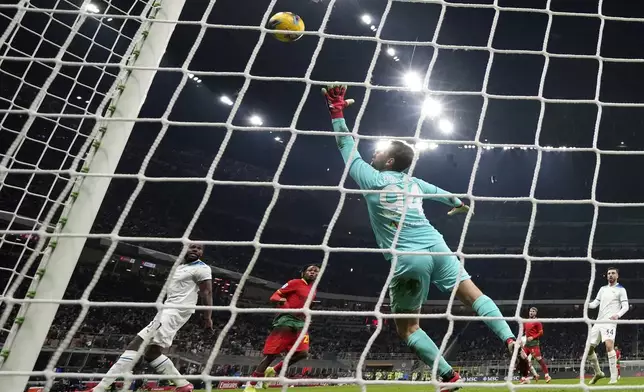 Lazio's goalkeeper Ivan Provedel fails to make a save during the Serie A soccer match between AC Milan and Lazio at the San Siro stadium, in Milan, Italy, Sunday, March 2, 2025. (AP Photo/Antonio Calanni)