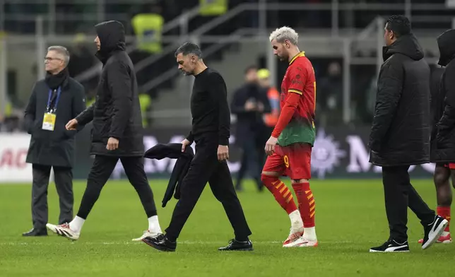 AC Milan's head coach Sergio Conceicao walks off the pitch after the Serie A soccer match between AC Milan and Lazio at the San Siro stadium, in Milan, Italy, Sunday, March 2, 2025. (AP Photo/Antonio Calanni)