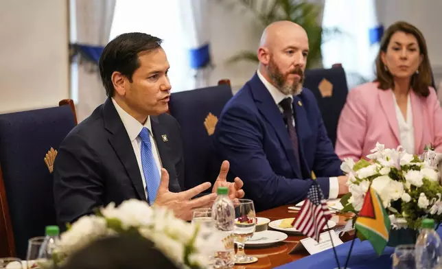 U.S. Secretary of State Marco Rubio, left, meets with Guyanese President Mohamed Irfaan Ali in Georgetown, Guyana, Thursday, March 27, 2025. (Nathan Howard/Pool photo via AP)