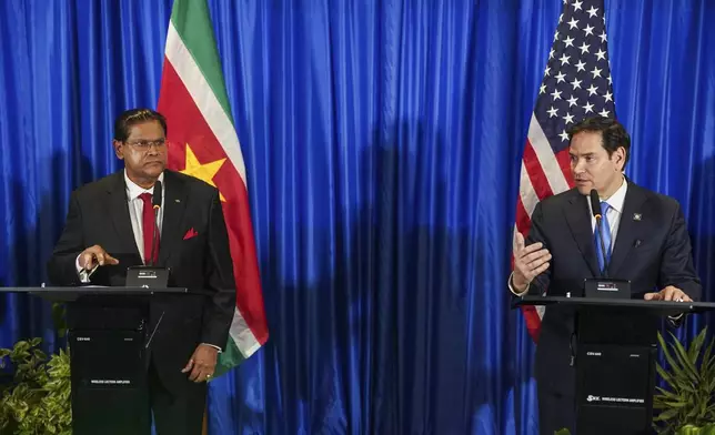 U.S. Secretary of State Marco Rubio, right, and Suriname's President Chan Santokhi give a joint press conference in Paramaribo, Suriname, Thursday, March 27, 2025. (Nathan Howard/Pool photo via AP)