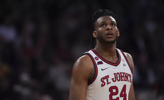 St. John's's Zuby Ejiofor (24) looks toward the stands during the second half of an NCAA college basketball game against the Marquette in the semifinals of the Big East tournament Friday, March 14, 2025, in New York. (AP Photo/Frank Franklin II)
