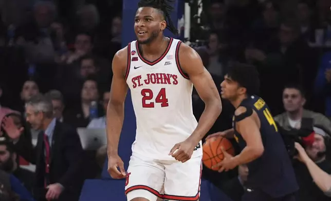 St. John's's Zuby Ejiofor (24) smiles after scoring during the second half of an NCAA college basketball game against the Marquette in the semifinals of the Big East tournament Friday, March 14, 2025, in New York. (AP Photo/Frank Franklin II)