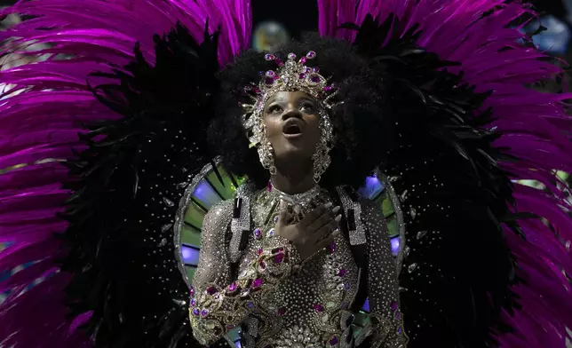 Drum queen Lorena Raissa from Beija-Flor samba school performs during Carnival celebrations at the Sambadrome in Rio de Janeiro, early Tuesday, March 4, 2025. (AP Photo/Bruna Prado)