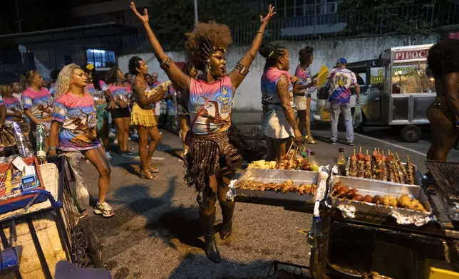 Transgender woman Negriny Venture dances during a Paraiso de Tuiuti samba school rehearsal for Carnival in Rio de Janeiro, Monday, Feb. 17, 2025. (AP Photo/Silvia Izquierdo)