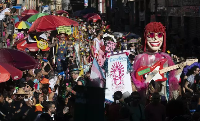 Revelers attend the "Ceu na Terra" or "Heaven on Earth" Carnival street party in Rio de Janeiro, Saturday, March 1, 2025. (AP Photo/Bruna Prado)