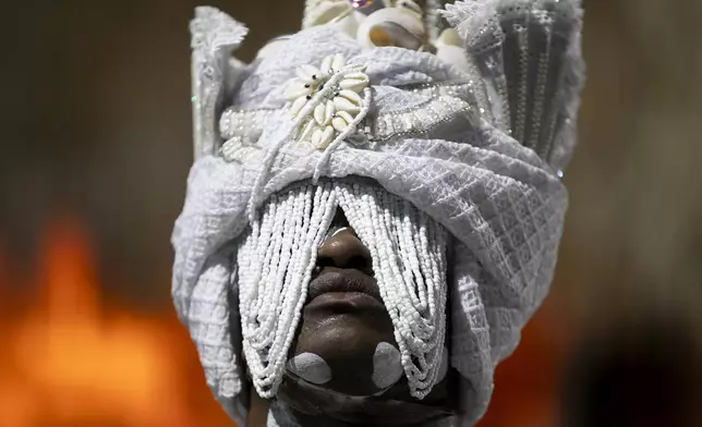 A performer from the Imperatriz Leopoldinense samba school parades during Carnival celebrations at the Sambadrome in Rio de Janeiro, Sunday, March 2, 2024. (AP Photo/Bruna Prado)