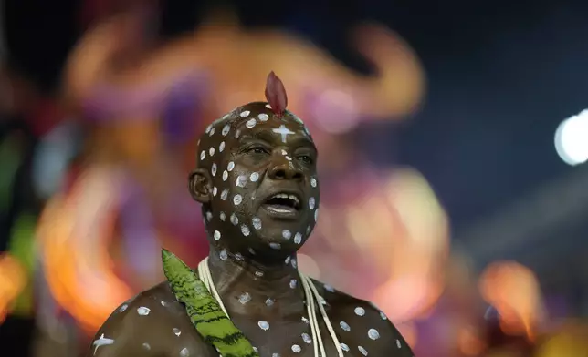A dancer from the Barroca Zona Sul samba school performs during a carnival parade in Sao Paulo, Saturday, March 1, 2025. (AP Photo/Andre Penner)