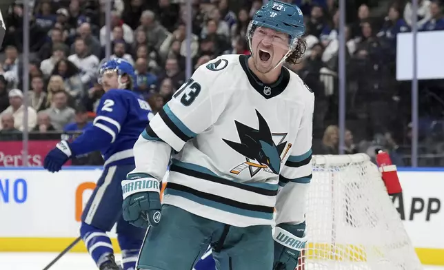 San Jose Sharks forward Tyler Toffoli (73) reacts after scoring during third-period NHL hockey game actionagainst the Toronto Maple Leafs in Toronto, Monday, March 3, 2025. (Nathan Denette/The Canadian Press via AP
