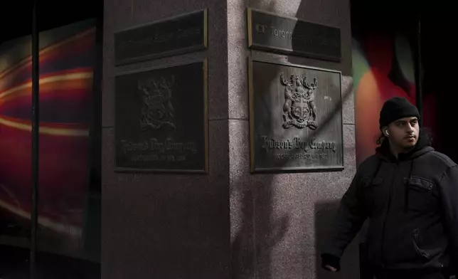 A man walks past the Hudson's Bay store in Toronto, Monday, March 10, 2025. (Chris Young/The Canadian Press via AP)