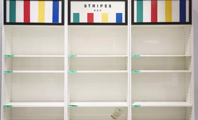 Empty shelves are seen at a Hudson's Bay department store in Toronto, Monday, March 17, 2025. (Christopher Katsarov/The Canadian Press via AP)