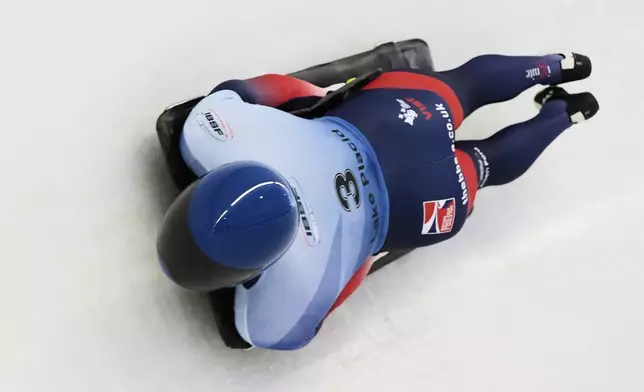 Marcus Wyatt, of Britain, slides during his third run at the skeleton world championships, Friday, March 7, 2025, in Lake Placid, N.Y. (AP Photo/Julia Demaree Nikhinson)