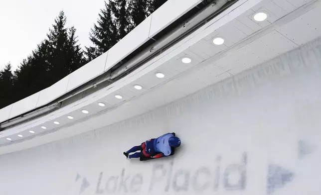 Matt Weston, of Britain, slides during his second run at the skeleton world championships, Thursday, March 6, 2025, in Lake Placid, N.Y. (AP Photo/Julia Demaree Nikhinson)