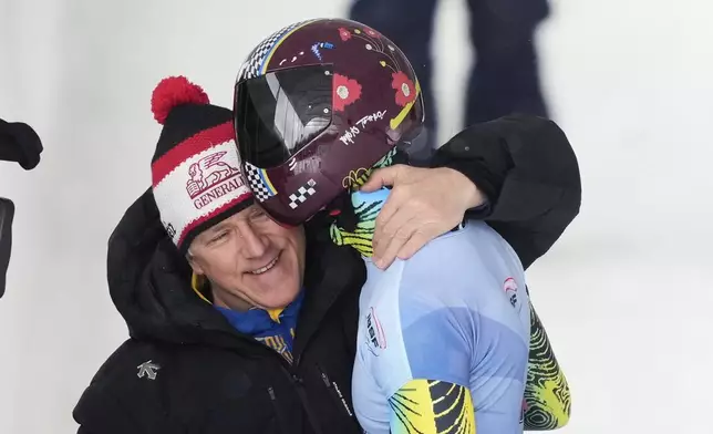Yaroslav Lavreniuk, of Ukraine, reacts after finishing his fourth run at the skeleton world championships, Friday, March 7, 2025, in Lake Placid, N.Y. (AP Photo/Julia Demaree Nikhinson)