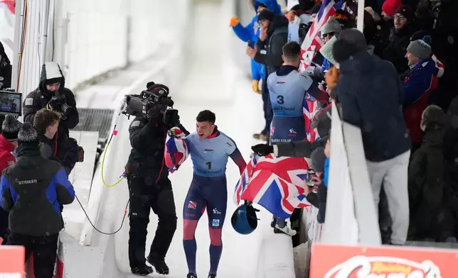 Matt Weston, of Britain, reacts after finishing his fourth run at the skeleton world championships, Friday, March 7, 2025, in Lake Placid, N.Y. (AP Photo/Julia Demaree Nikhinson)