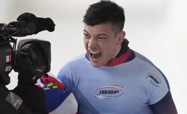 Matt Weston, of Britain, reacts after finishing his fourth run at the skeleton world championships, Friday, March 7, 2025, in Lake Placid, N.Y. (AP Photo/Julia Demaree Nikhinson)