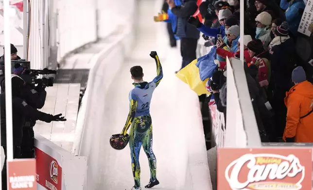 Yaroslav Lavreniuk, of Ukraine, reacts after finishing his fourth run at the skeleton world championships, Friday, March 7, 2025, in Lake Placid, N.Y. (AP Photo/Julia Demaree Nikhinson)