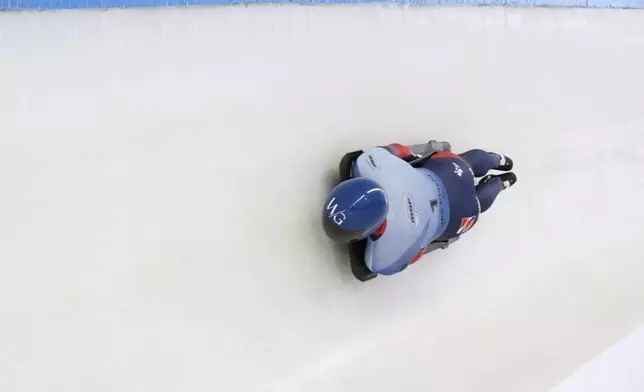 Matt Weston, of Britain, slides during his third run at the skeleton world championships, Friday, March 7, 2025, in Lake Placid, N.Y. (AP Photo/Julia Demaree Nikhinson)