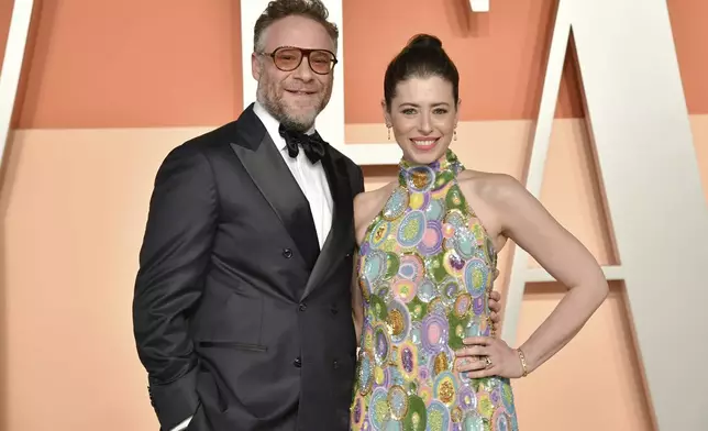 Seth Rogen and Lauren Miller Rogen arrive at the Vanity Fair Oscar Party on Sunday, March 2, 2025, at the Wallis Annenberg Center for the Performing Arts in Beverly Hills, Calif. (Photo by Evan Agostini/Invision/AP)