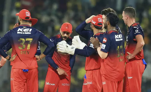Royal Challengers Bengaluru's Virat Kohli, center, celebrates with teammates the dismissal of Chennai Super Kings' Deepak Hooda during the Indian Premier League cricket match between Chennai Super Kings and Royal Challengers Bengaluru at M. A. Chidambaram Stadium in Chennai, India, Friday, March 28, 2025. (AP Photo/R. Parthibhan)