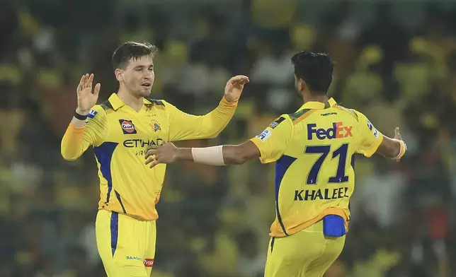 Chennai Super Kings' Noor Ahmad and Khaleel Ahmed celebrate the dismissal of Royal Challengers Bengaluru's Virat Kohli during the Indian Premier League cricket match between Chennai Super Kings and Royal Challengers Bengaluru at M. A. Chidambaram Stadium in Chennai, India, Friday, March 28, 2025. (AP Photo/R. Parthibhan)