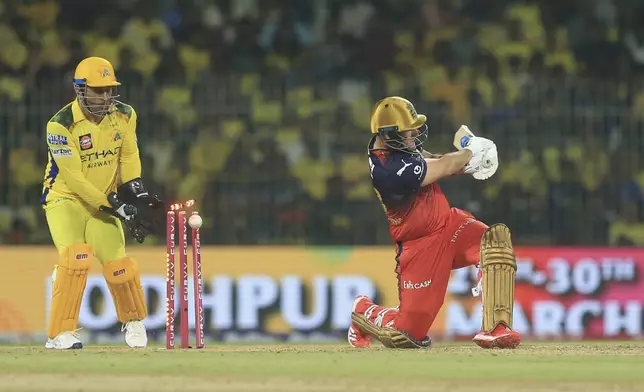 Royal Challengers Bengaluru's Liam Livingstone bold by Chennai Super Kings' Noor Ahmad during the Indian Premier League cricket match between Chennai Super Kings and Royal Challengers Bengaluru at M. A. Chidambaram Stadium in Chennai, India, Friday, March 28, 2025. (AP Photo/R. Parthibhan)