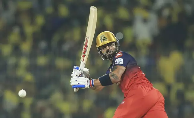Royal Challengers Bengaluru's Virat Kohli plays a shot during the Indian Premier League cricket match between Chennai Super Kings and Royal Challengers Bengaluru at M. A. Chidambaram Stadium in Chennai, India, Friday, March 28, 2025. (AP Photo/R. Parthibhan)