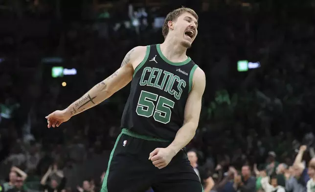 Boston Celtics' Baylor Scheierman celebrates his 3-pointer during second half of an NBA basketball game against the Brooklyn Nets Tuesday, March 18, 2025, in Boston. (AP Photo/Michael Dwyer)