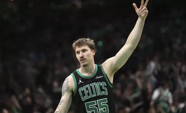 Boston Celtics' Baylor Scheierman celebrates his 3-pointer during second half of an NBA basketball game against the Brooklyn Nets Tuesday, March 18, 2025, in Boston. (AP Photo/Michael Dwyer)
