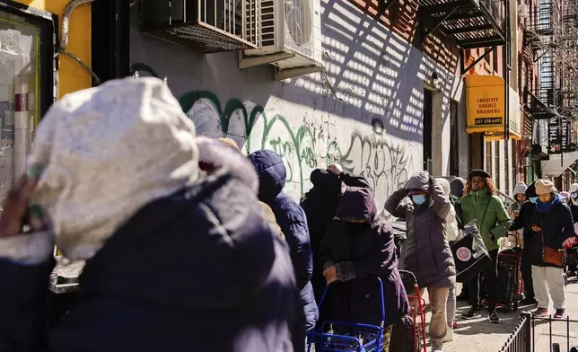 People continue waiting in line after FarmerJawn Agriculture ran out of free eggs at an egg giveaway, Friday, March 21, 2025, in the Harlem neighborhood of New York. (AP Photo/Julia Demaree Nikhinson)