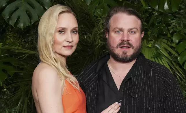 Mona Fastvold, left, and Brady Corbet arrive at Chanel's 16th Annual Pre-Oscar Awards Dinner on Saturday, March 1, 2025, at The Beverly Hills Hotel in Beverly Hills, Calif. (Photo by Jordan Strauss/Invision/AP)