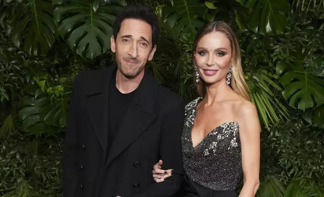 Adrien Brody, left, and Georgina Chapman arrive at Chanel's 16th Annual Pre-Oscar Awards Dinner on Saturday, March 1, 2025, at The Beverly Hills Hotel in Beverly Hills, Calif. (Photo by Jordan Strauss/Invision/AP)
