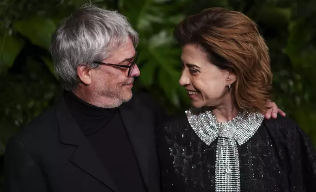 Andrucha Waddington, left, and Fernanda Torres arrive at Chanel's 16th Annual Pre-Oscar Awards Dinner on Saturday, March 1, 2025, at The Beverly Hills Hotel in Beverly Hills, Calif. (Photo by Jordan Strauss/Invision/AP)