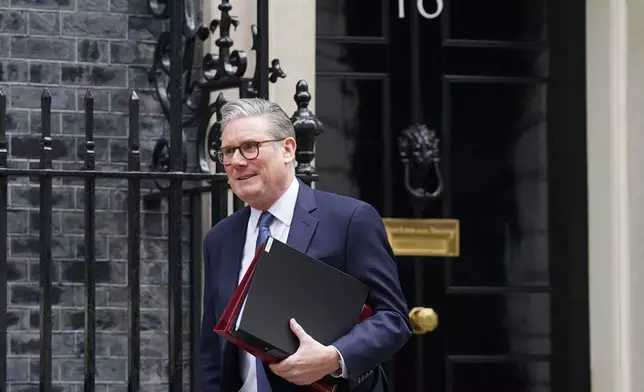 Prime Minister Sir Keir Starmer departs 10 Downing Street to attend Prime Minister's Questions at the Houses of Parliament in London, England, Wednesday, March 12, 2025. (Stefan Rousseau/PA via AP)
