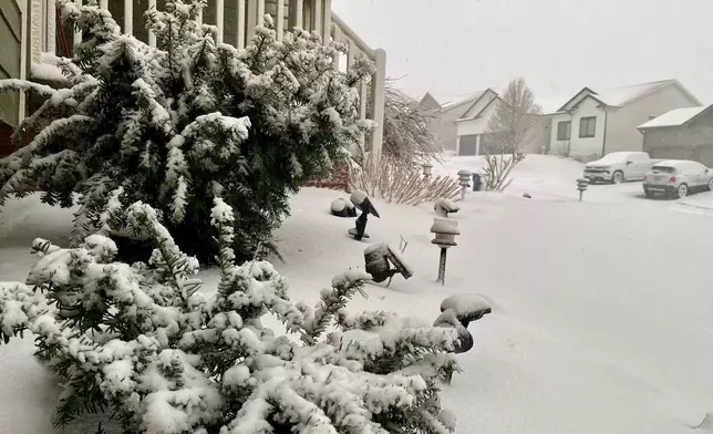 The streets are covered with snow after a storm on Wednesday, March 19, 2025 in Omaha, Neb. (AP Photo/Margery Beck)