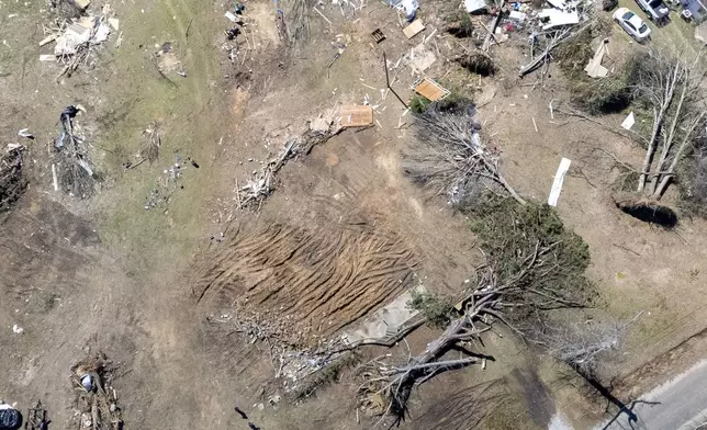 This image taken with a drone shows storm damage from what's left of Annie Free's home at the Lovelady Lane and Dallas County 63 interchange, Monday, March 17, 2025, in Plantersville, Ala. Annie Free, 82, died Saturday after a Tornado struck her home, leaving only the front patio behind. (AP Photo/Vasha Hunt)