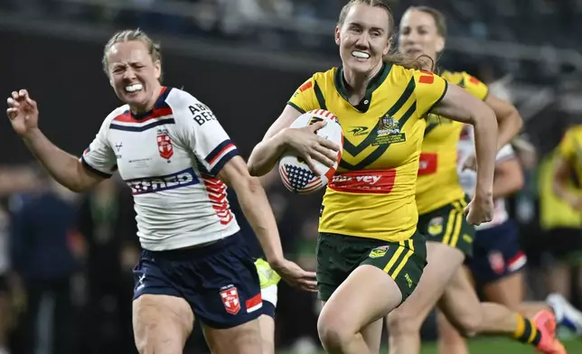 Australian Jillaroo Tamika Upton runs to score a try during the rugby league international between Australia's Jillaroos and England at Allegiant Stadium in Las Vegas, Saturday, March 1, 2025. (AP Photo/David Becker)