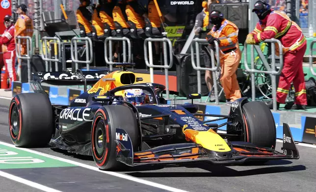 Red Bull driver Max Verstappen of the Netherlands steers his car down pit lane during the first practice session for the Australian Formula One Grand Prix at Albert Park, in Melbourne, Australia, Friday, March 14, 2025. (AP Photo/Asanka Brendon Ratnayake)