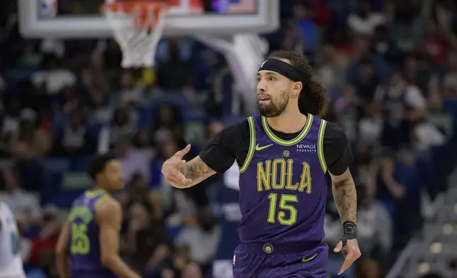 New Orleans Pelicans guard Jose Alvarado (15) celebrates a three-point basket during the first half of an NBA basketball game against the Memphis Grizzlies in New Orleans, Sunday, March 9, 2025. (AP Photo/Matthew Hinton)