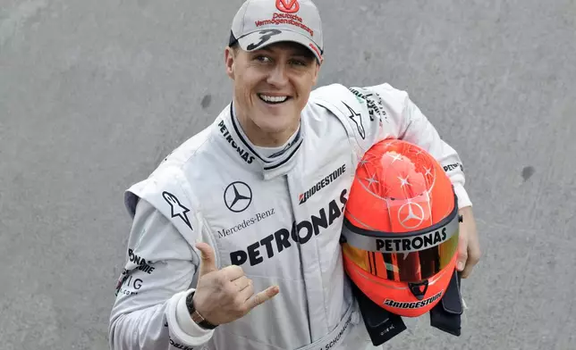 FILE - Mercedes Formula One driver Michael Schumacher of Germany poses during a photo call at the Ricardo Tormo race track in Cheste, just outside Valencia, Spain Monday Feb. 1, 2010 (AP Photo/Daniel Ochoa de Olza, File)