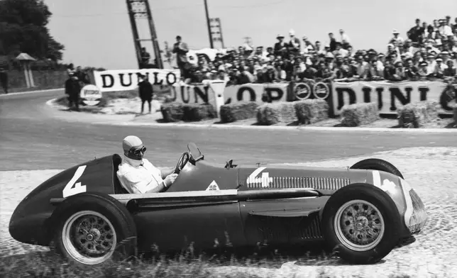 FILE - Juan Manuel Fangio comes out of a bend at speed during the race, driving a supercharged 1.5 Liter . Alfa Romeo during the Grand Prix D'Europe at Rheims, France , July 1, 1951. (AP Photo/File)