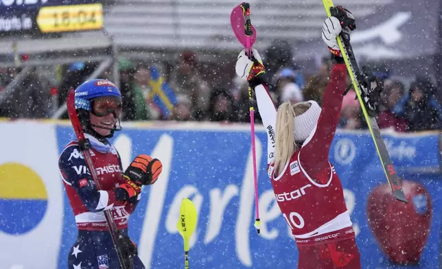 United States' Mikaela Shiffrin applauds the winner Austria's Katharina Truppe after an alpine ski, women's World Cup slalom in Are, Sweden, Sunday, March 9, 2025. (AP Photo/Giovanni Auletta)