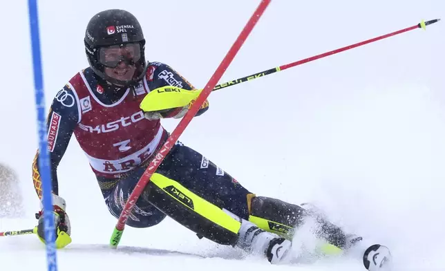 Sweden's Sara Hector speeds down the course during an alpine ski, women's World Cup slalom in Are, Sweden, Sunday, March 9, 2025. (AP Photo/Giovanni Auletta)