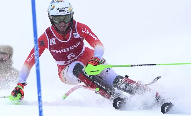 Switzerland's Camille Rast speeds down the course during an alpine ski, women's World Cup slalom in Are, Sweden, Sunday, March 9, 2025. (AP Photo/Giovanni Auletta)