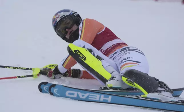 Germany's Emma Aicher after falling on the course during an alpine ski, women's World Cup slalom in Are, Sweden, Sunday, March 9, 2025. (AP Photo/Giovanni Auletta)