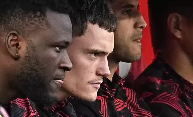 Leverkusen's Victor Boniface and Florian Wirtz react disappointed on the benchduring the Bundesliga soccer match between Bayer Leverkusen and Werder Bremen at the BayArena in Leverkusen, Germany, Saturday, March 8, 2025. (AP Photo/Martin Meissner)